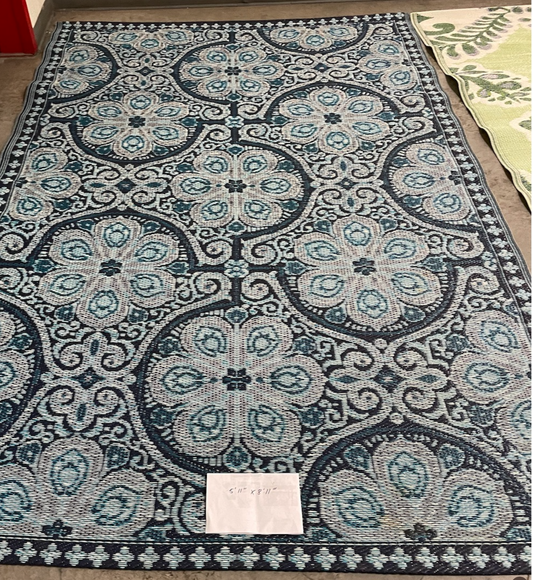 Outdoor rug with blue pattern