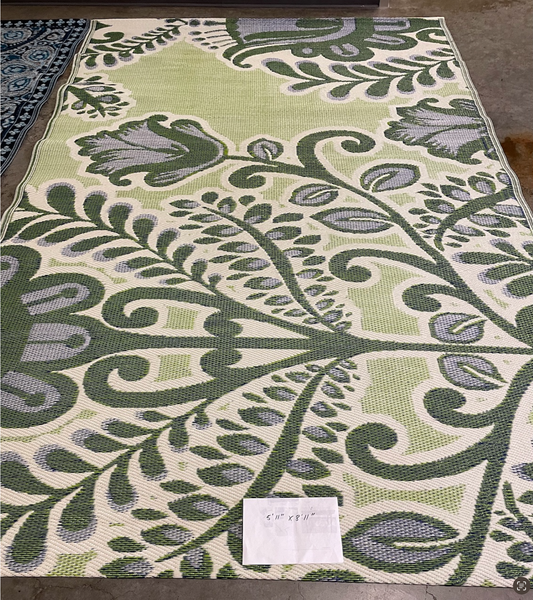 Outdoor rug with green, cream and blue