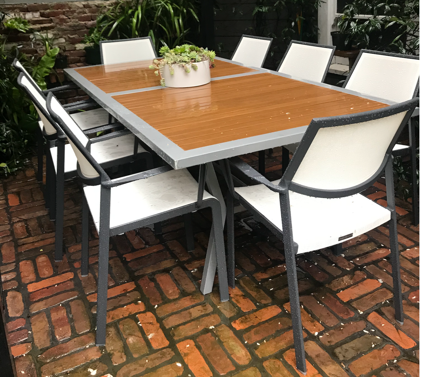 White mesh outdoor dining chairs with charcoal powder coated frame