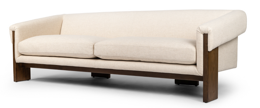 Cairo sofa in cream. Inspired by vintage Brazilian design. Wide plank legs
