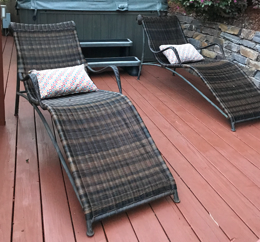 Brown resin wicker lounge chairs