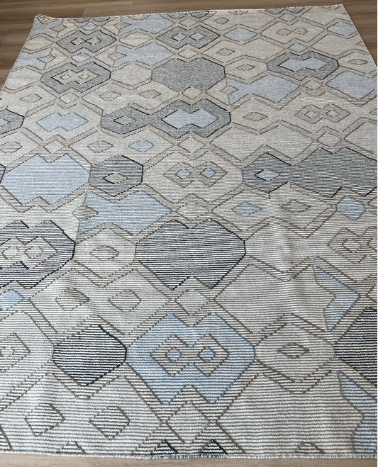 Flat weave rug in cream, gray and blues