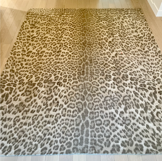 Cheetah print rug in tan and brown
