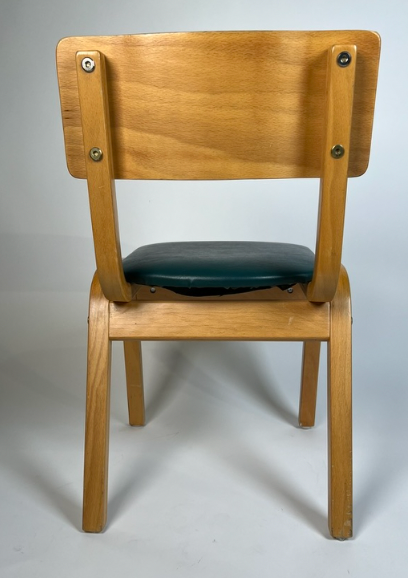 Vintage child chair with green seat