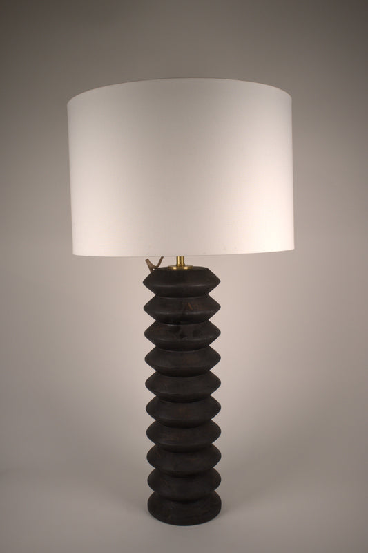 Tall black wood accordion table lamp
