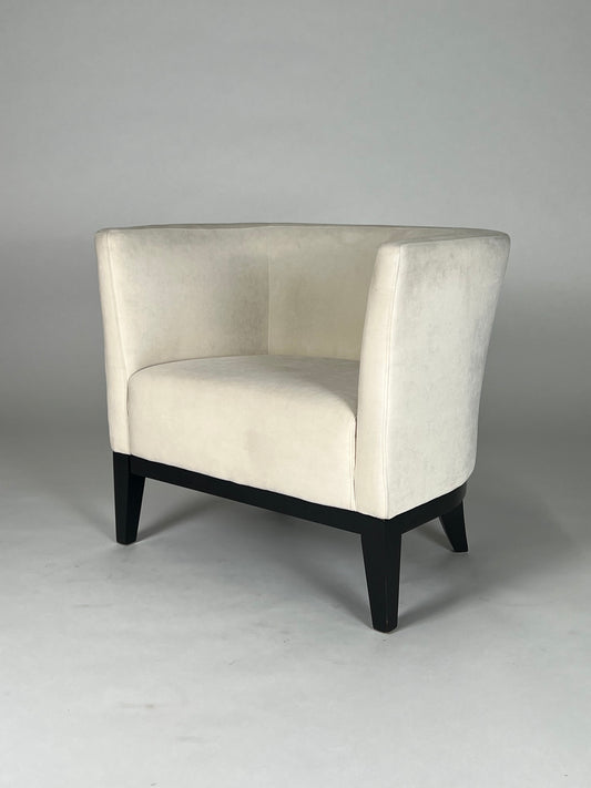 White velvet round back chair with black legs
