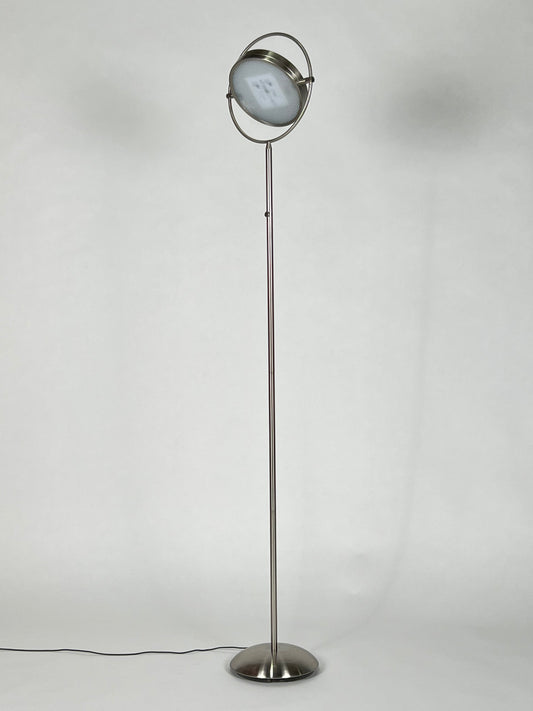 Silver floor lamp with articulating head