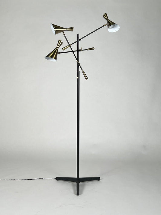 Champagne brass and black three headed articulating floor lamp
