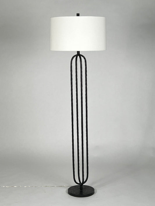 Black iron floor lamp with cream shade
