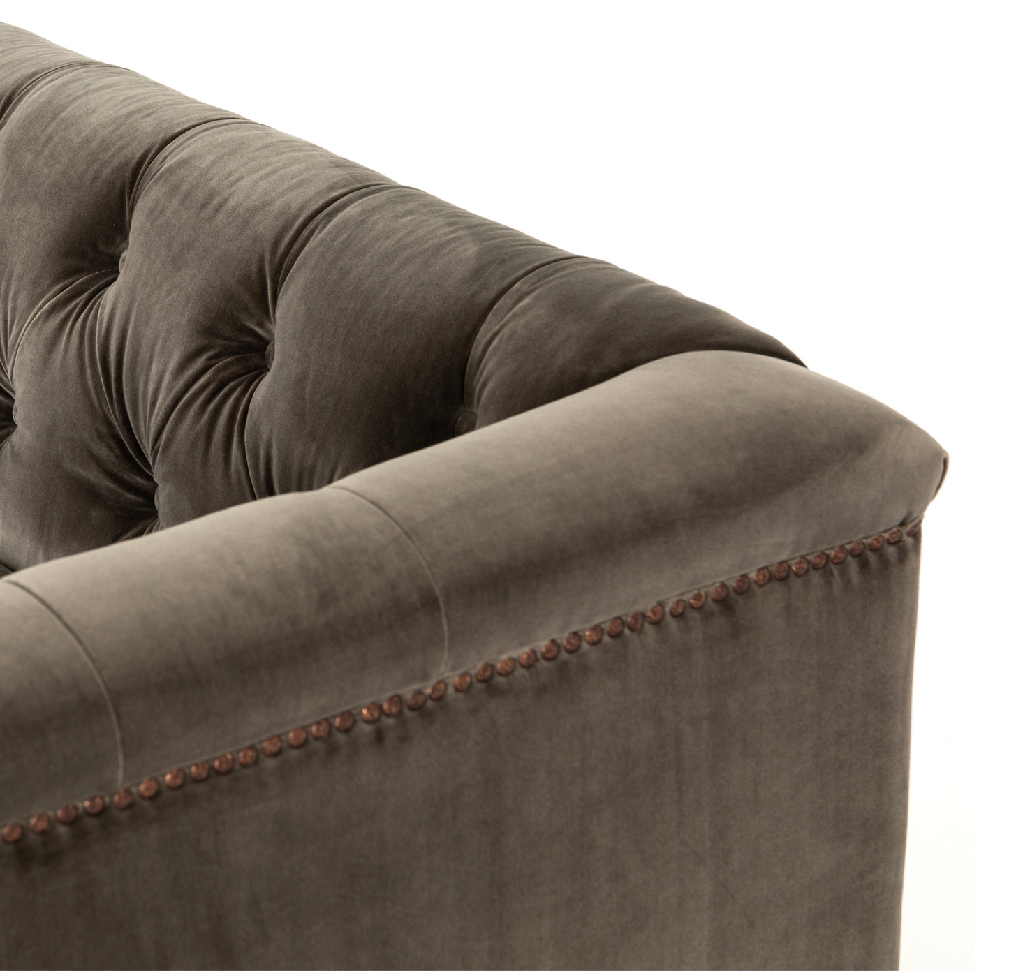 Brown tufted velvet library sofa with aged bronze nailhead trim