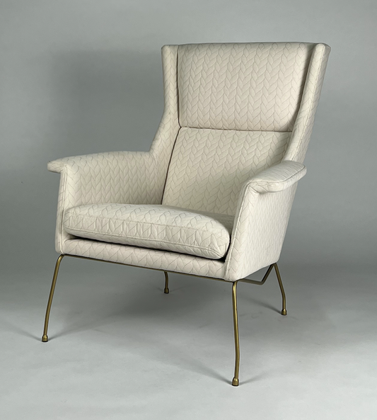 Cream tall back chair with stitched cable pattern, brass legs