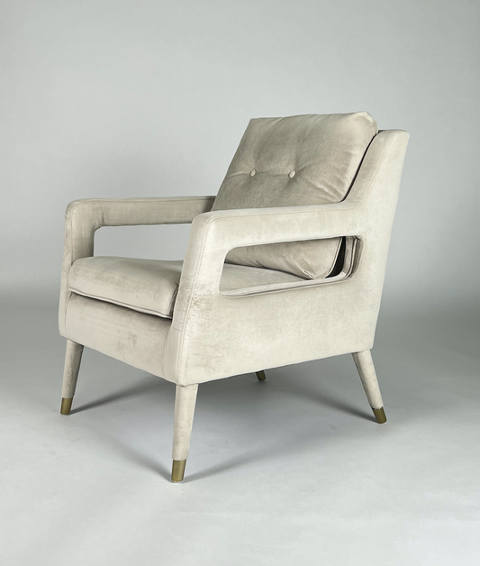 Cream velvet square arm chair with brass tips on legs