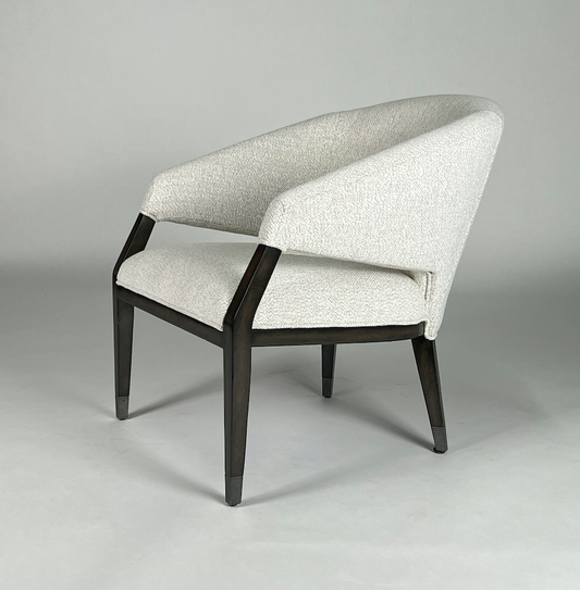 Off white fabric chair with dark wood frame, round back