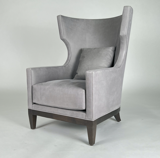 Soft gray leather, tall modern wing back chair with rounded back and dark legs