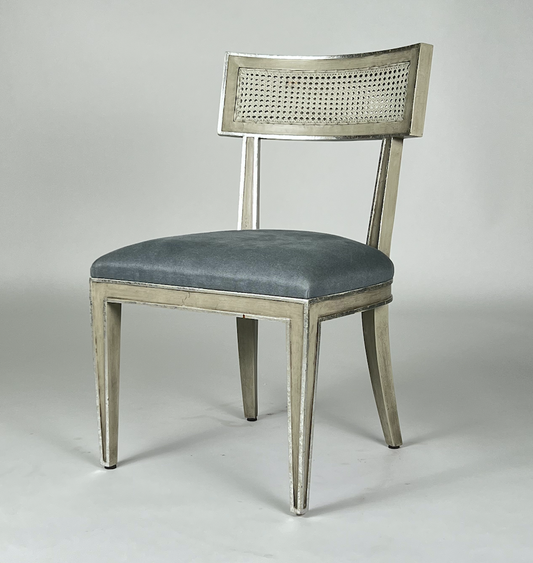 Gray cane back chair with blue fabric seat, metallic details