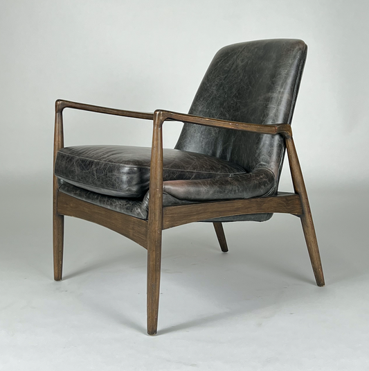 Dark smoke leather chair with sculpted wood arms and frame