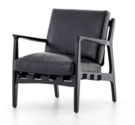 Black hand finished leather chair with black wood frame. Back has strapping made of canvas, leather and buckles