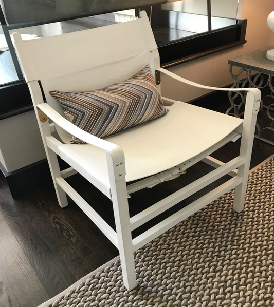 White leather campaign chair with white wood frame