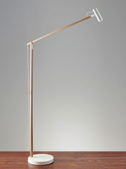 Crane floor lamp of slim wood with white head, articulates