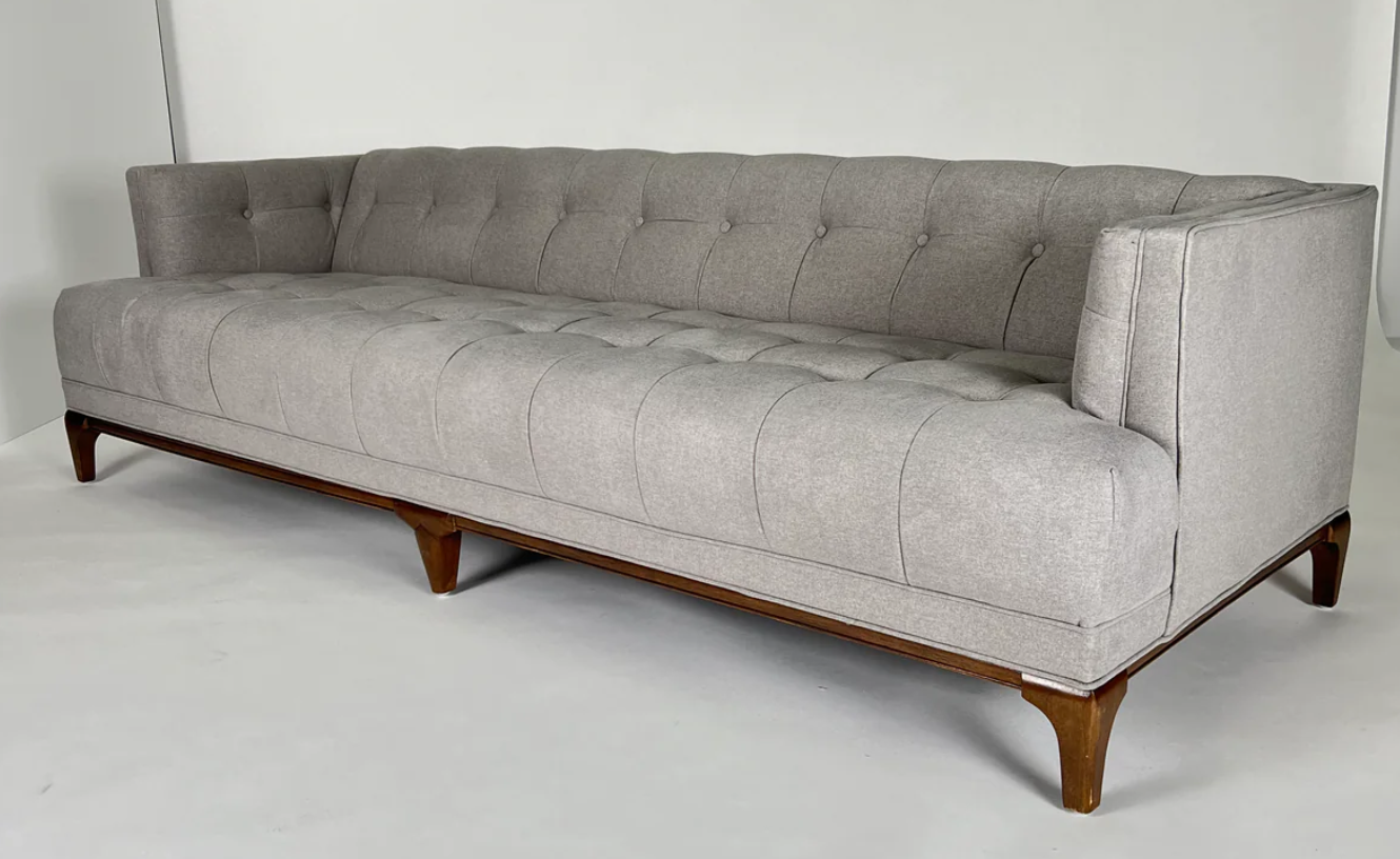 Soft gray sofa, blind tufting, walnut frame and legs, mid-century styling