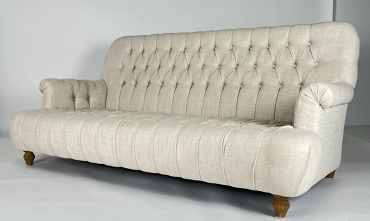 Cream linen tufted sofa, rolled arm and deep seat