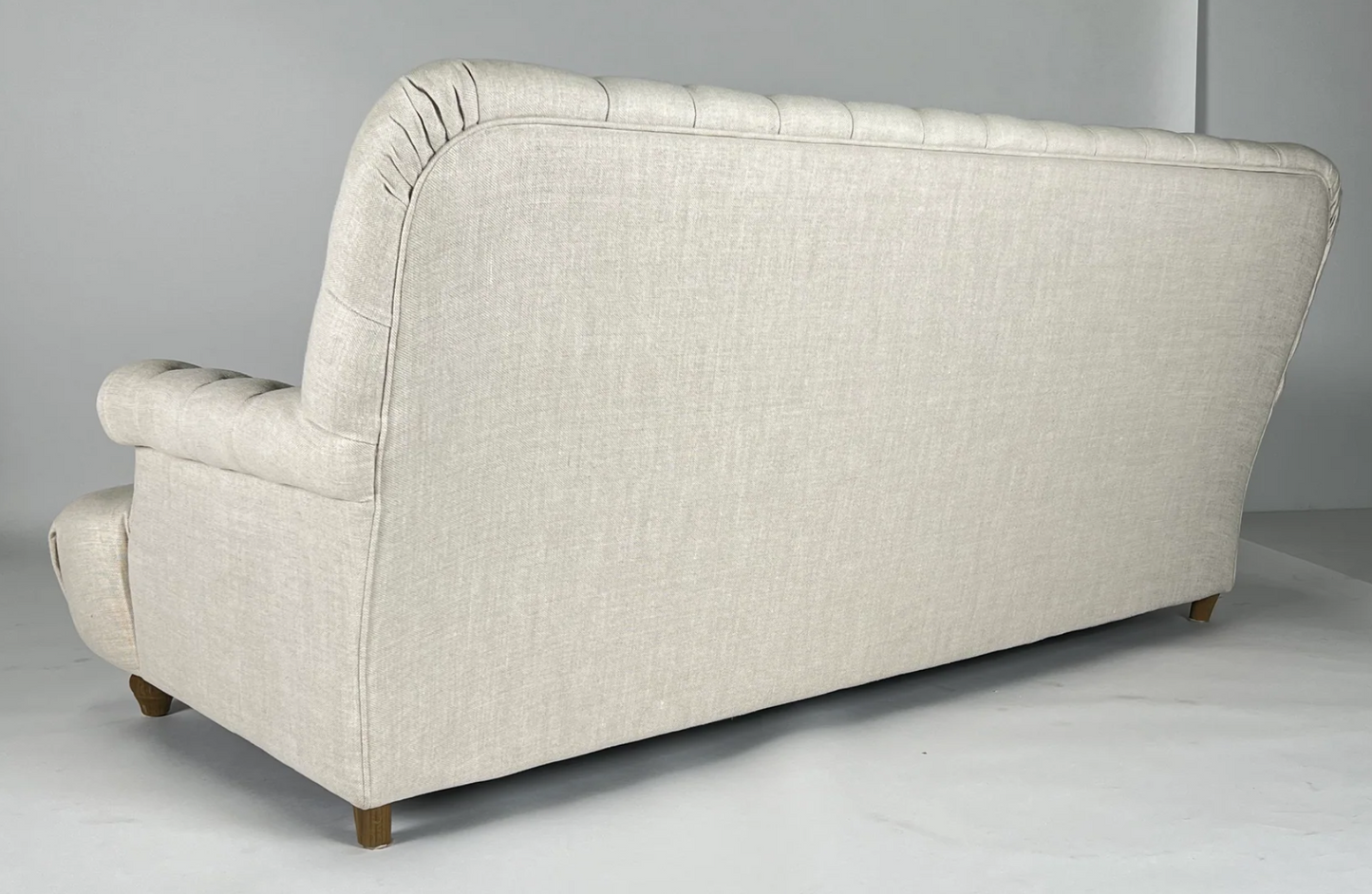 Cream linen tufted sofa, rolled arm and deep seat