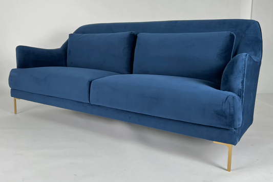 Blue velvet sofa with curved back, brass legs