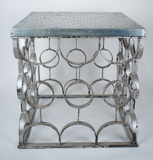 Matte metal side table, with nailed surface