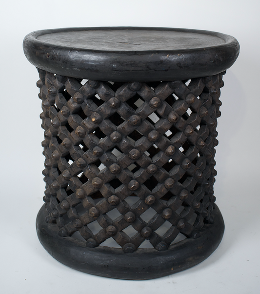 Hand carved black drum side table