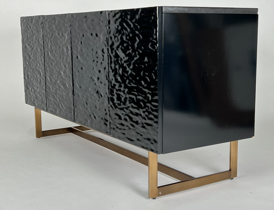 Glossy black sculpted media cabinet or buffet with brass base