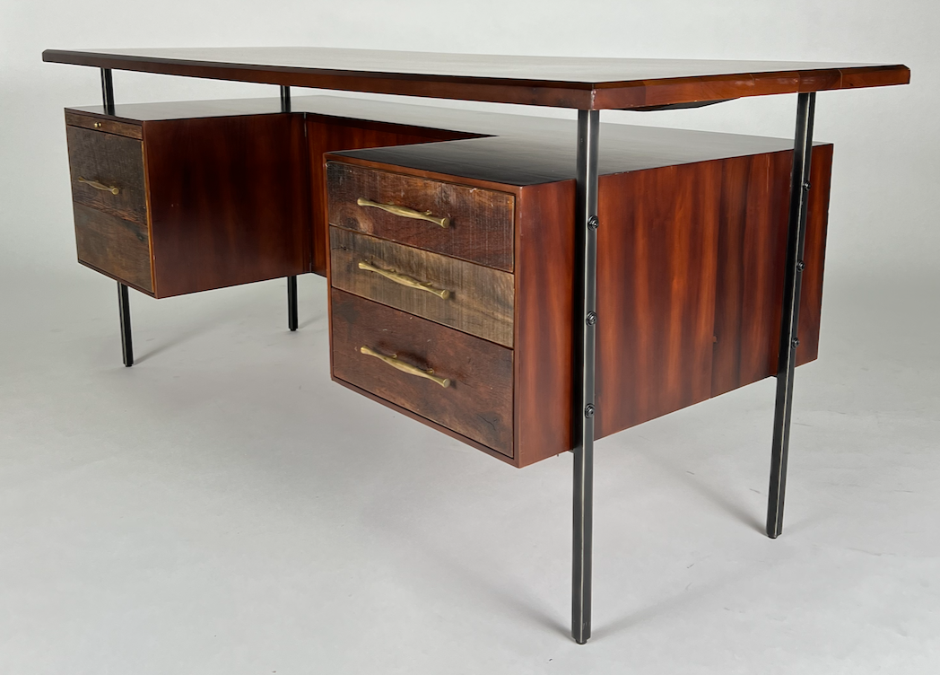 Dark wood desk with brass hardware, floated top, iron legs