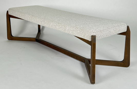 Bench with stone colored fabric seat and dark brown wood frame