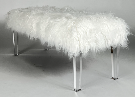 White faux fur seat atop clear acrylic legs