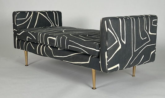Graphic black and cream print bench with brass painted tapered legs