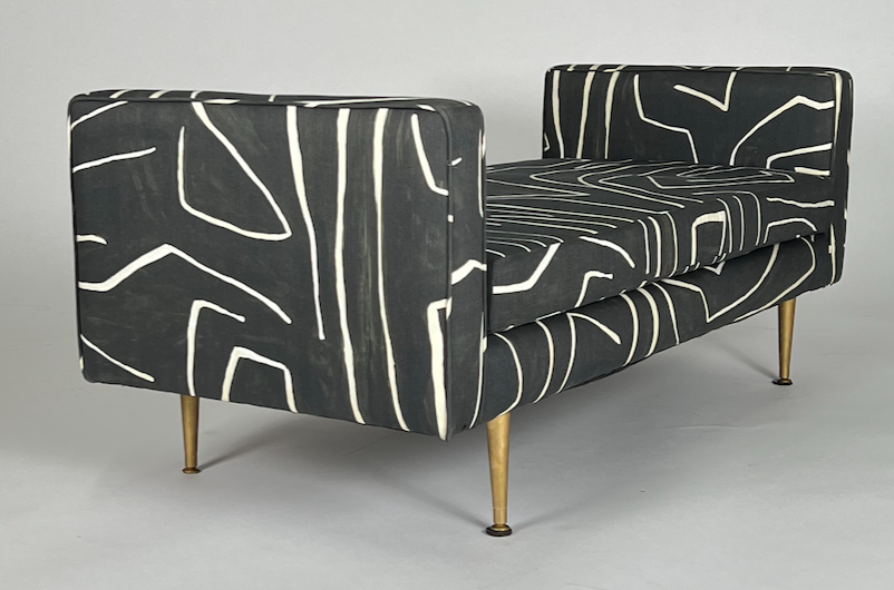 Graphic black and cream print bench with brass painted tapered legs