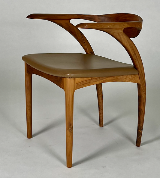 Shapely aerodynamic mid century styling dining chairs with toffee leather seat