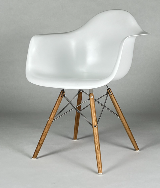 White Eames like bucket chair with arms and wood legs