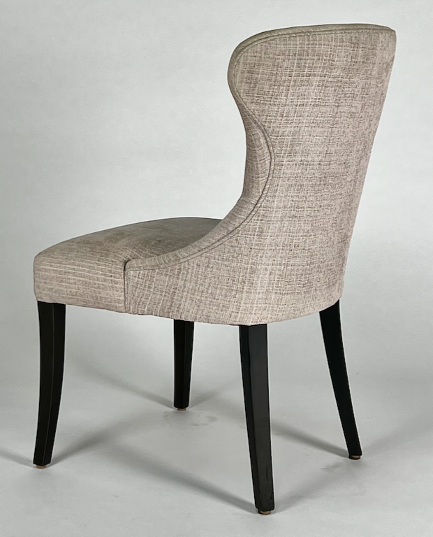 Taupe upholstered chair with black legs