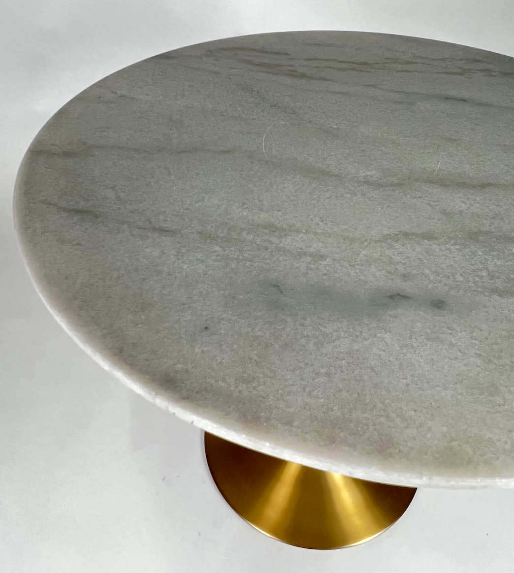 Round white marble dining table with brass tulip base