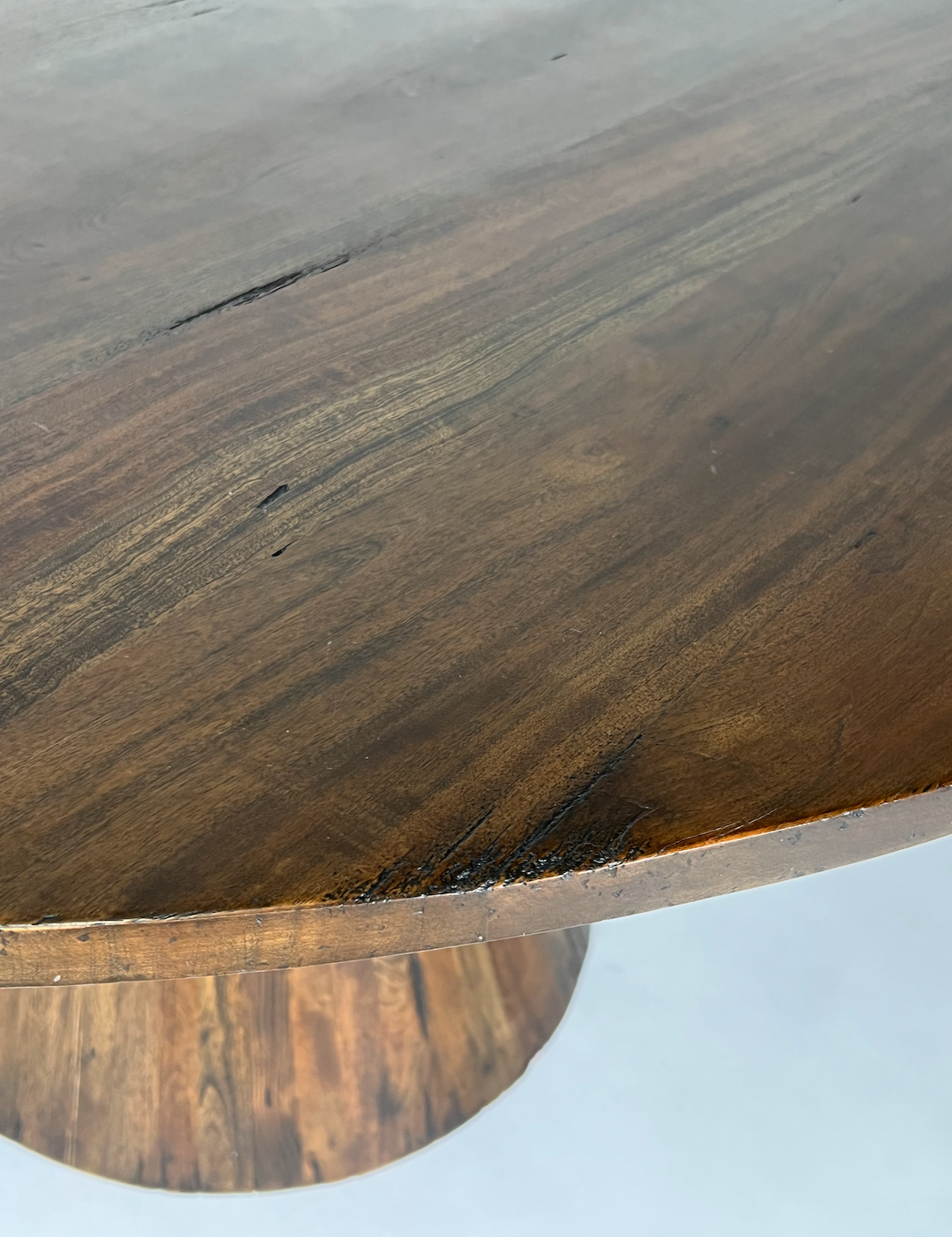 Round wood pedestal dining table