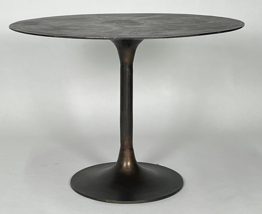 Round antique rust dining table with tulip pedestal base