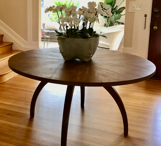 Round cerused wood dining table