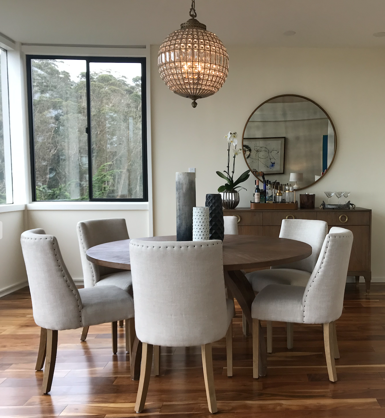 Round cerused wood dining table
