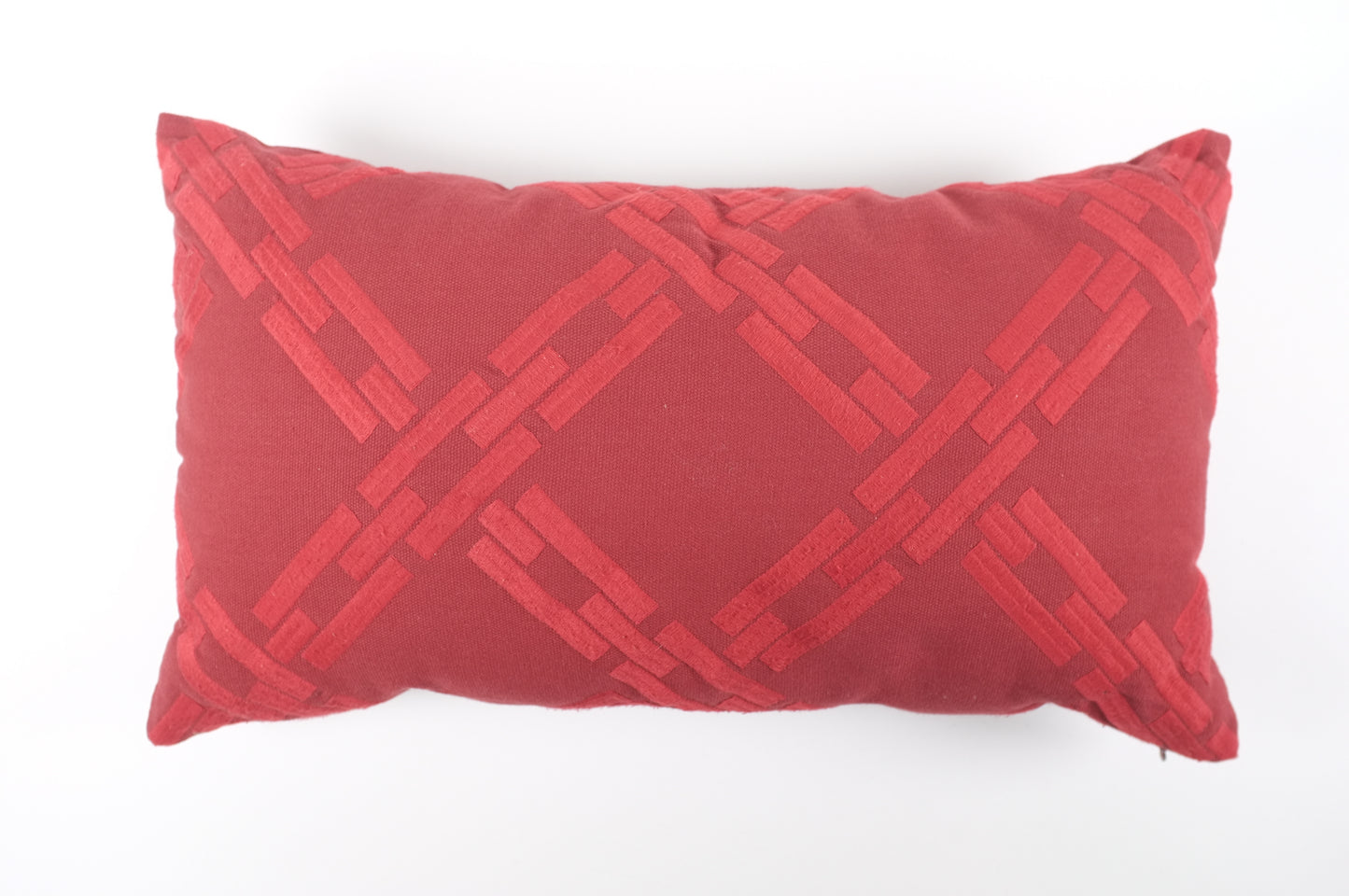 Red lumbar pillow with chain link pattern