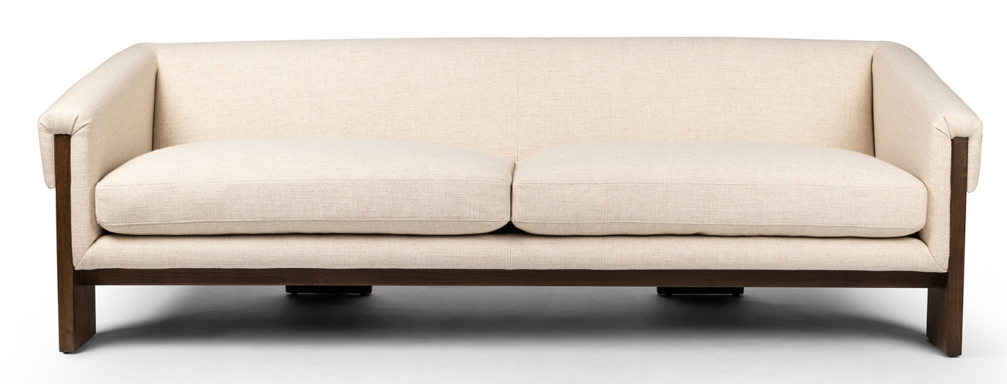 Cairo sofa in cream. Inspired by vintage Brazilian design. Wide plank legs