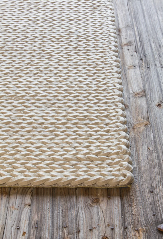 Light gray felted and braided rug