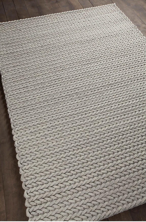 Light gray felted and braided rug