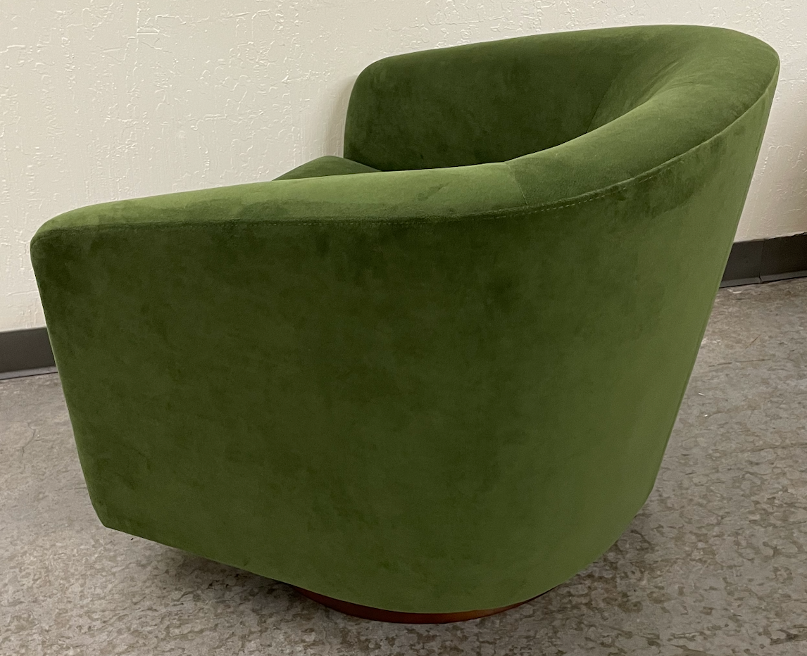 Green velvet swivel chair
