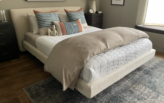 Queen upholstered cream bed,  Bensen