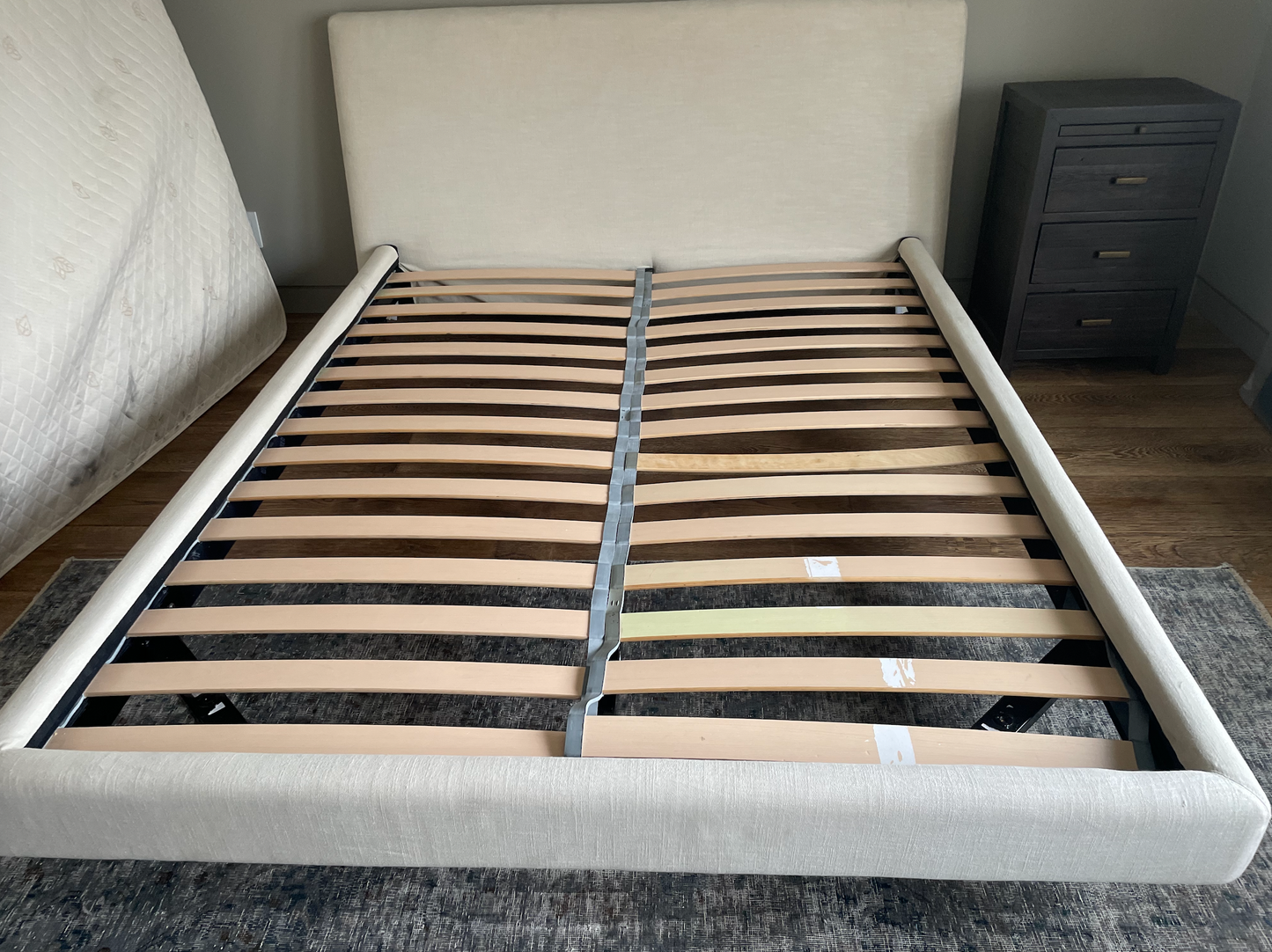 Queen upholstered cream bed,  Bensen